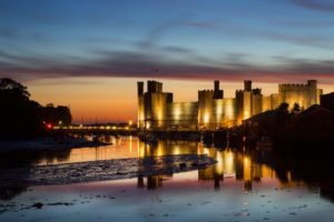 Caernarfon Castle in Wales at sunset