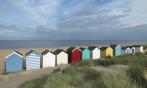 A row of colourful beach huts