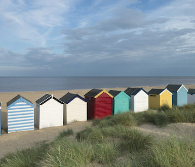 A row of colourful beach huts