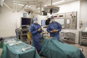Two medical staff in an operating theatre