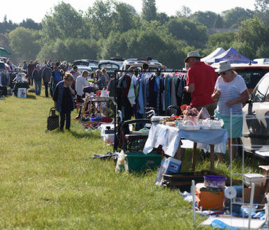 People Shopping At A Car Boot Sale