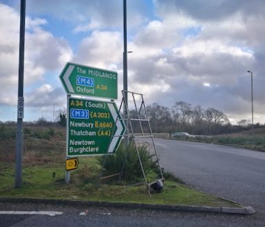 Photo showing a road sign with directions to M roads, A roads and B roads