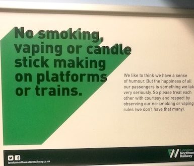 Sign on a train saying 'No smoking, vaping or candle stick making on platforms or trains'