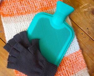 Hot water bottle and fingerless gloves