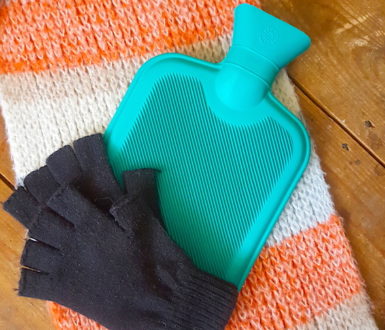 Hot water bottle and fingerless gloves