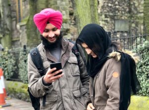 Two young people laughing together